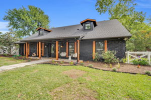 Wooden fencing surrounds the extensive backyard and provides solar lighting for those evening outdoor moments
