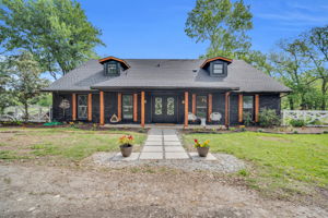 Large pavers create a natural walkway feature to your large iron front doors ready to embrace your presence