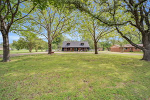 This home is nestled among mature trees in a desirable area