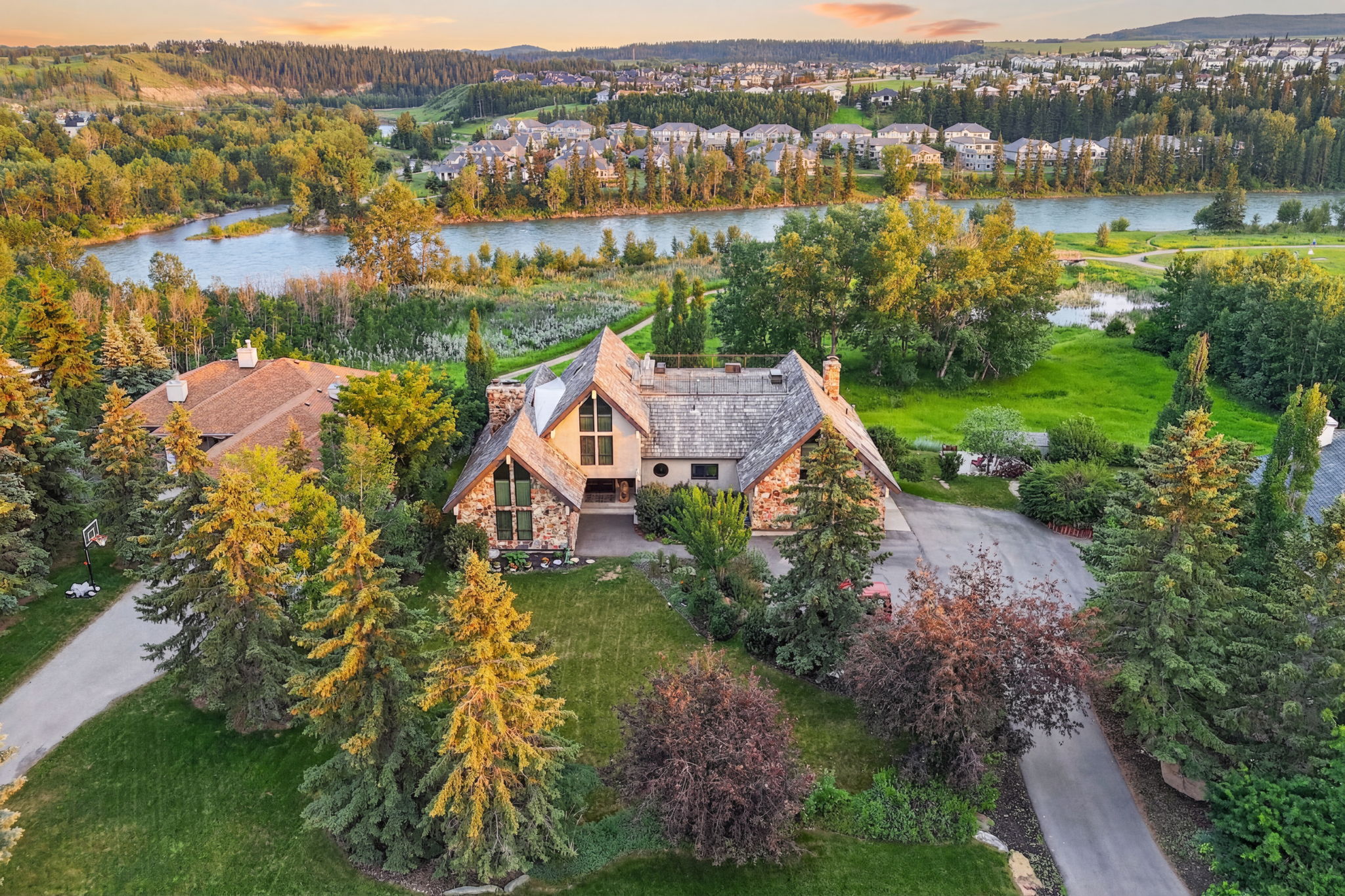 Backing onto the Bow River and a natural reserve
