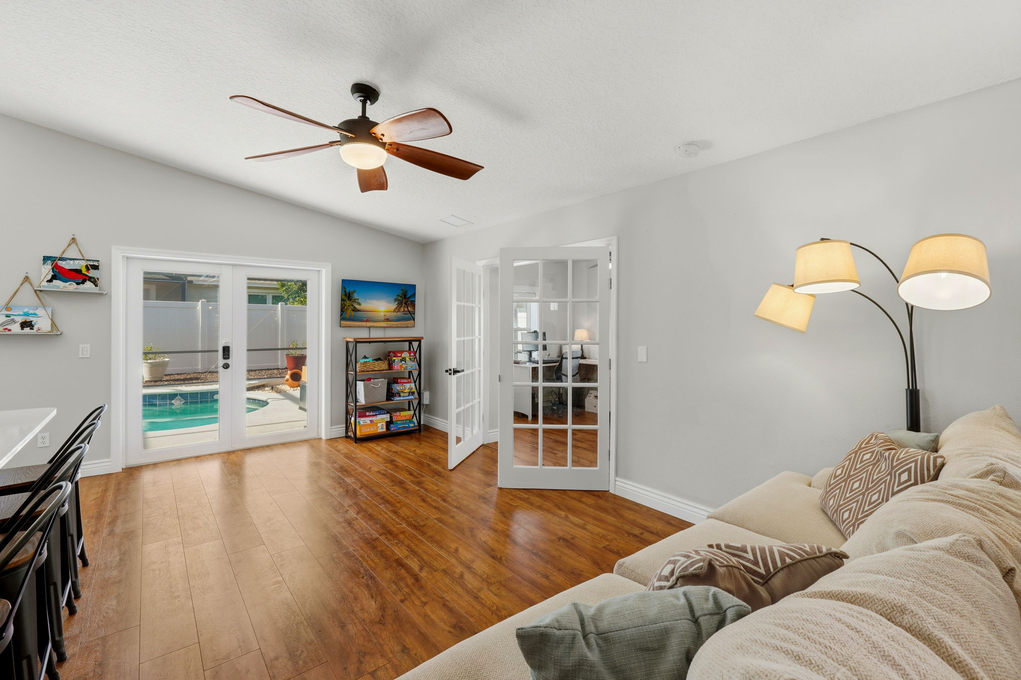 Versatile Family Room with Pool Access through French Doors