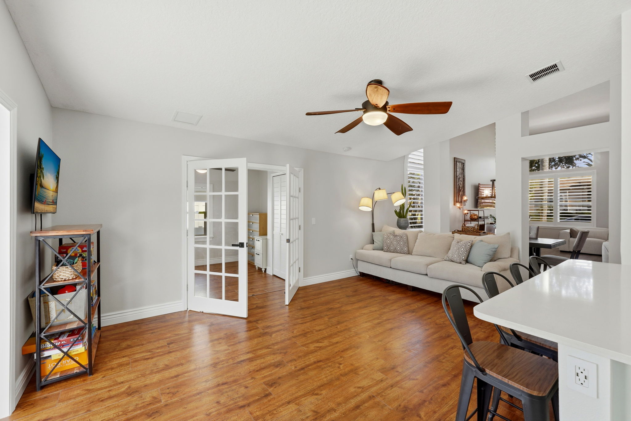 Family Room with 1st Floor Bedroom 2 behind the Double French Doors