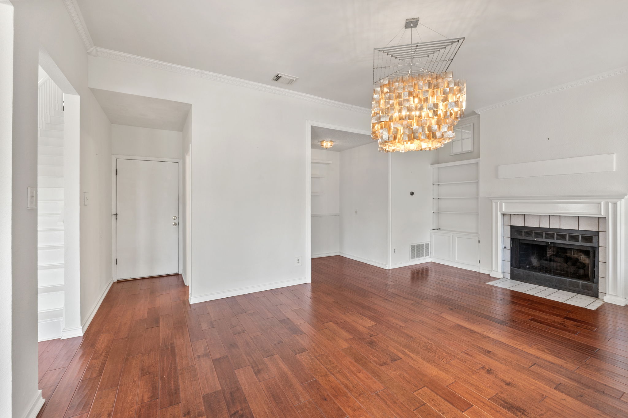 The small nook provides a space for a bars' cart, or perhaps a reading nook. The flexibility of this family room offers many choices.