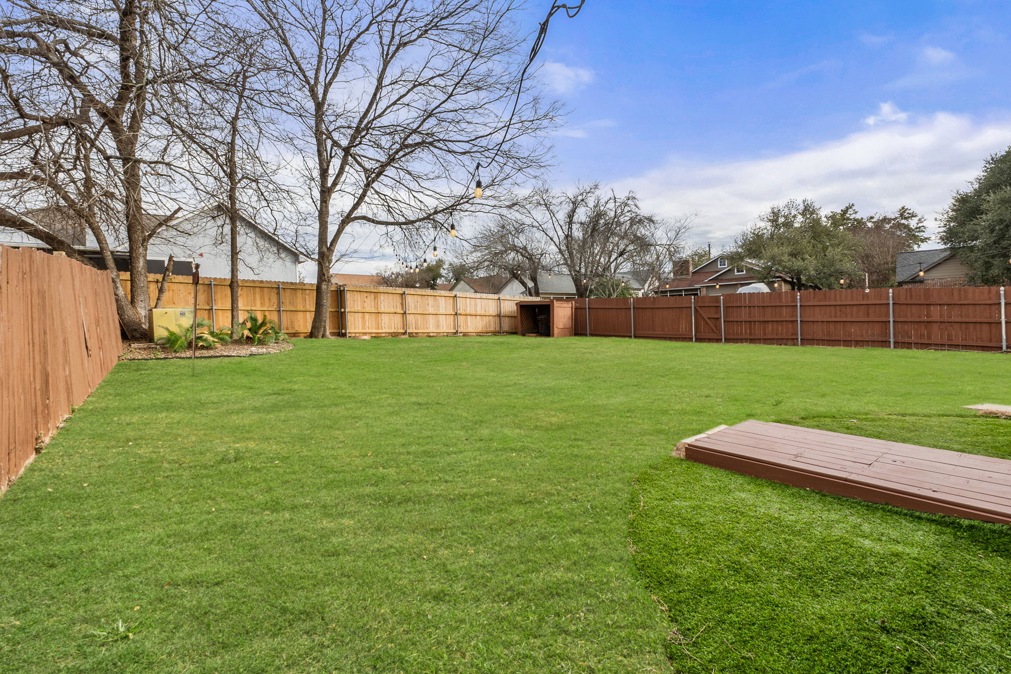 The generously sized backyard provides room for customization by its new owner.