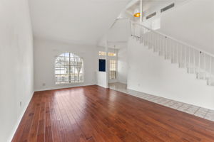 Engineered hardwoods are features in the formal living area.