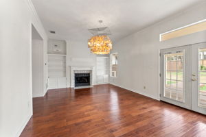 Bright neutral colored walls, the double doors and transom window flood the room with natural light.