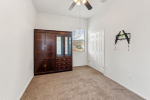 The fourth bedroom has the same brown carpet color and the tall curio/bookcase is negotiable.