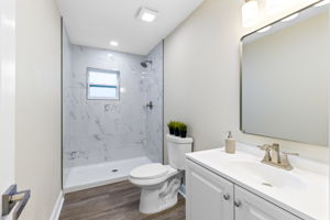 Updated bathroom with modern finishes.