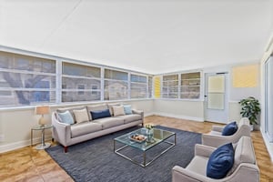 Sunroom virtually staged to illustrate a flexible indoor-outdoor living space.
