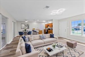 Spacious living area virtually staged to illustrate layout possibilities.