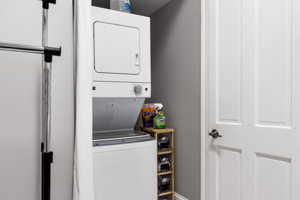 A huge walk-in closet with a stack W&D