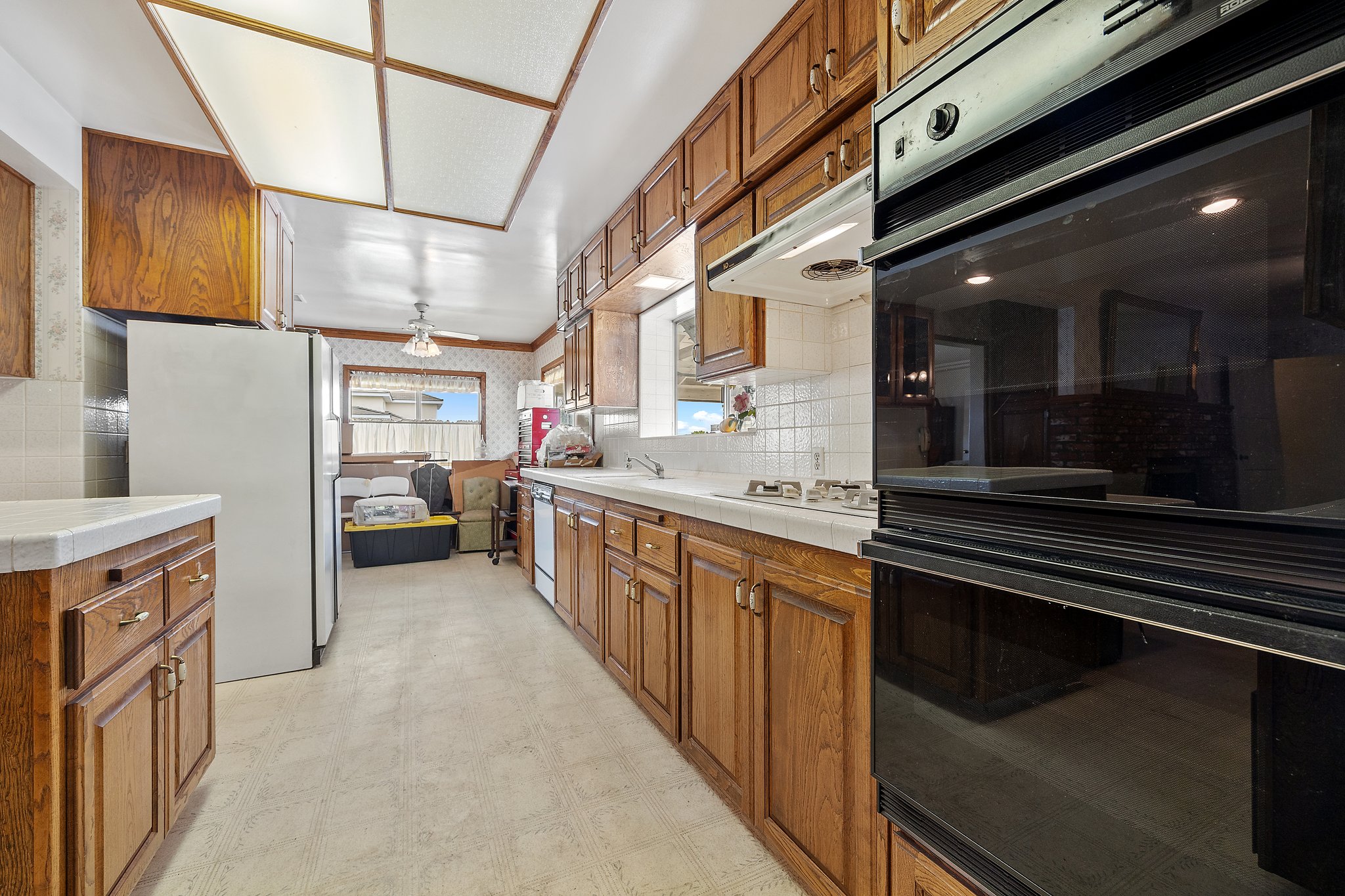 solid cabinets and tile counter-tops