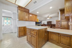 Tons of cabinets and laundry room off kitchen