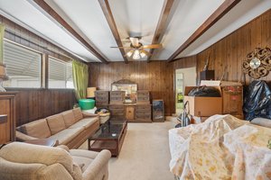 Step down family room with open beams