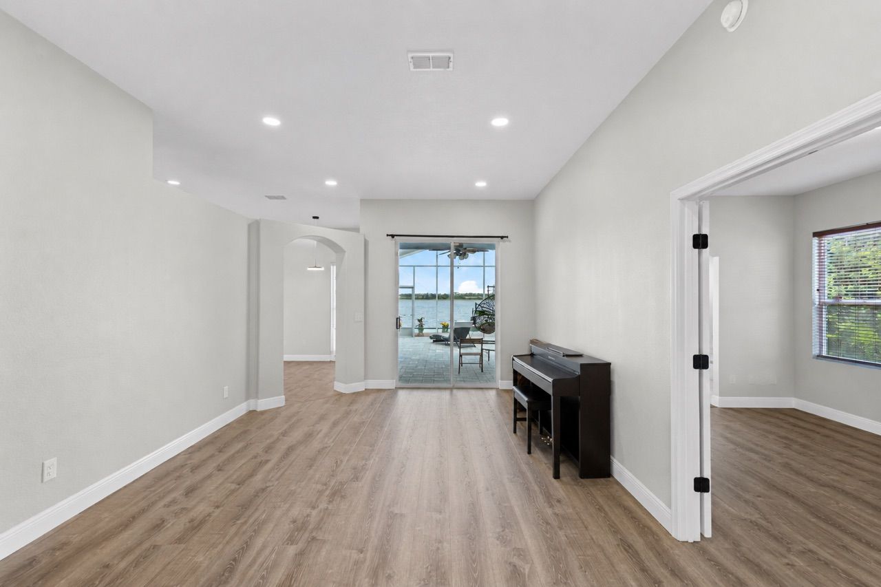 Foyer/Living Room with View to Master Suite & Patio
