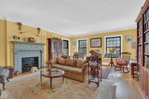 Second floor, large sunny living room with elegant decorative fireplace