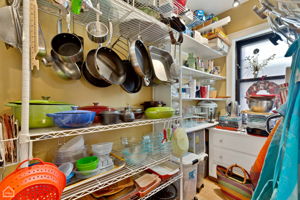 Large pantry with built-ins plus utility closet in kitchen of both units