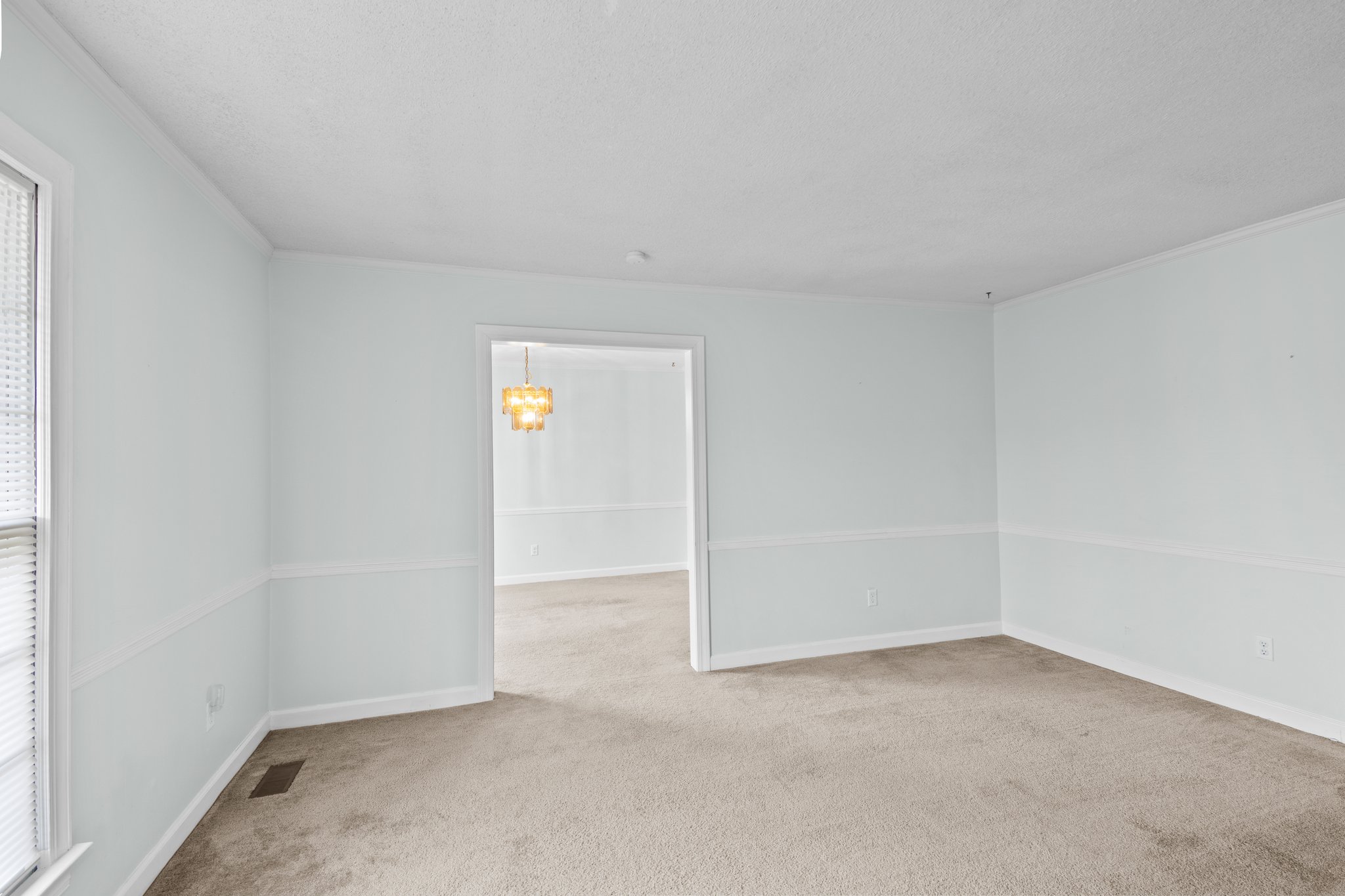 Formal living room looking into dining room