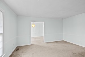 Formal living room looking into dining room