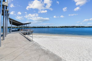 White-sand beach boardwalk and dock