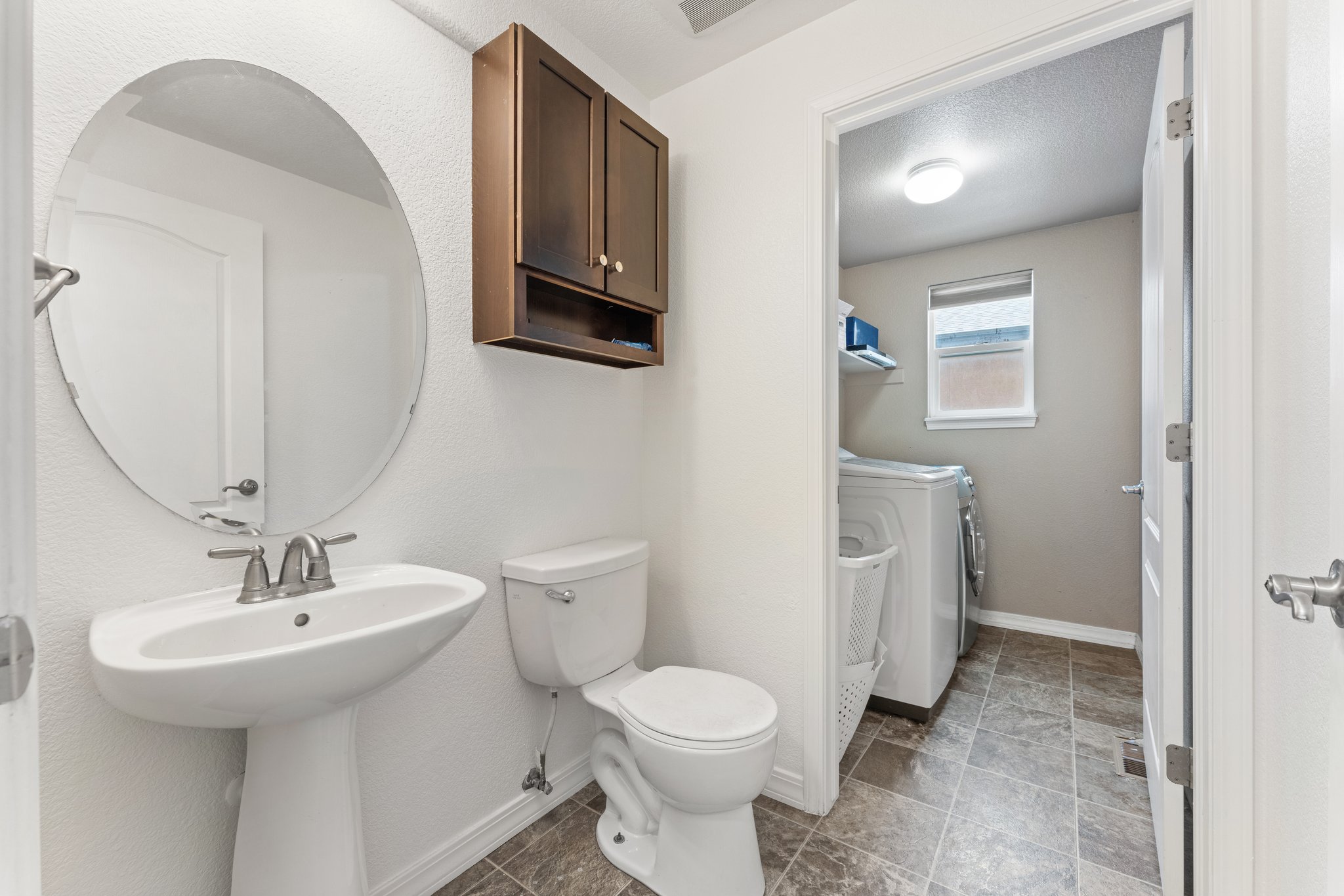 Main Level Half Bath with Laundry Room