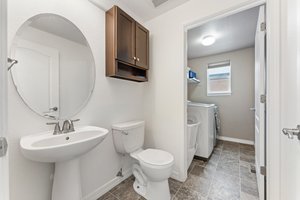 Main Level Half Bath with Laundry Room