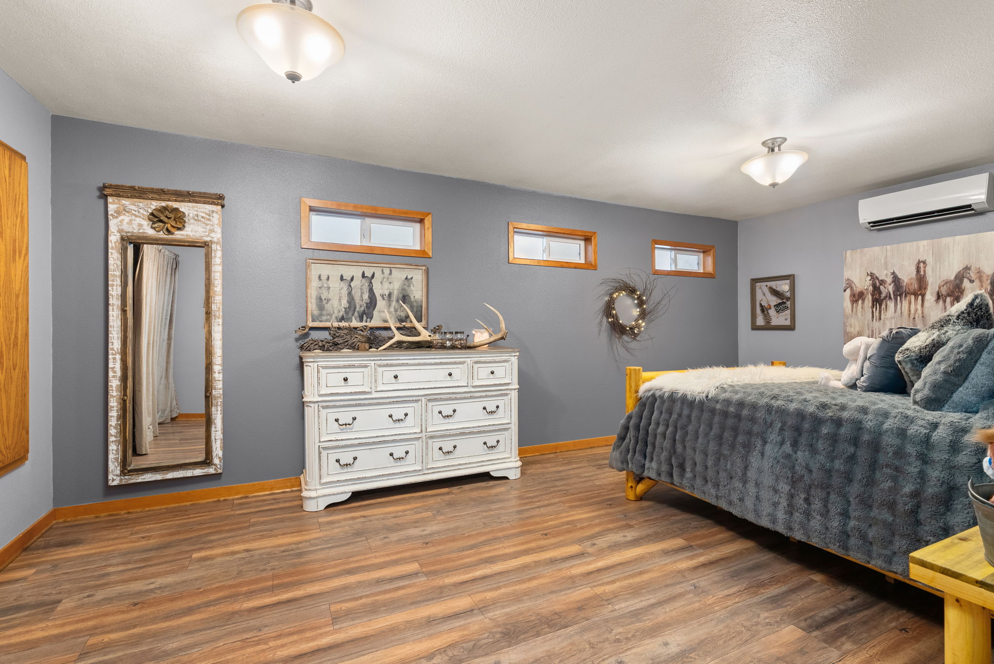 Generously sized lower-level bedroom located near the bonus room, flex space, and laundry