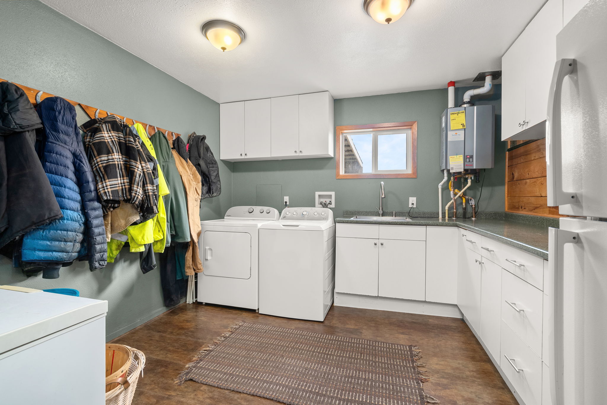 Generous laundry room with ample space for boots, blankets, and gear