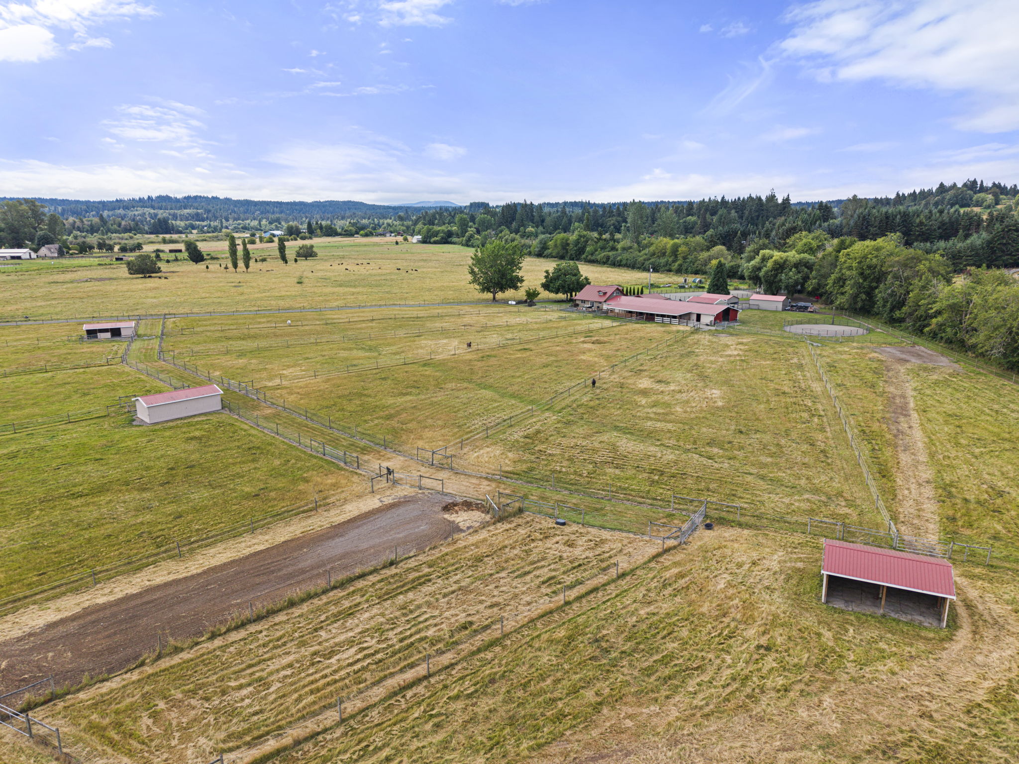 Designed for year-round functionality with 12 fenced pastures, three loafing sheds, access gates, breezeway and frost free spigots throughout for easy horse rotation and ranch management