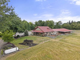 A rare attached 9-stall barn offers unmatched convenience for equestrian living