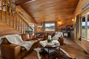 The cozy propane stove creates the perfect setting to unwind after a day on the ranch