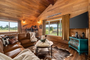 Take in scenic pasture views and the beautiful approach to Keystone Ranch from the comfort of your living room