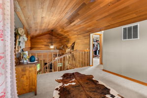 An inviting primary loft or private guest suite