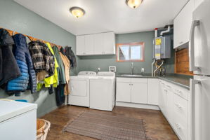 Generous laundry room with ample space for boots, blankets, and gear
