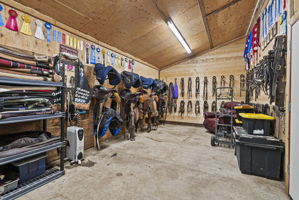 More than a tack room—this spacious area provides abundant storage and a welcoming space to relax between rides