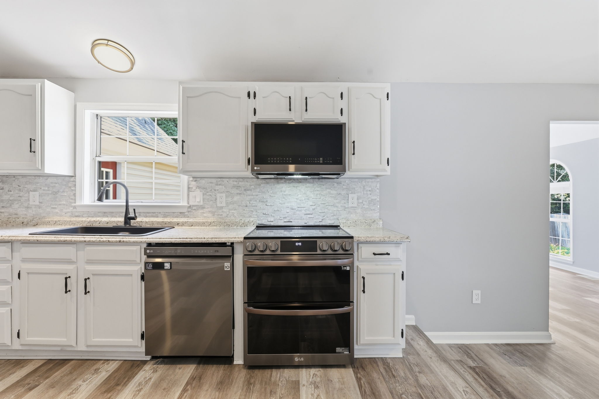 Black Stainless appliances including a double oven