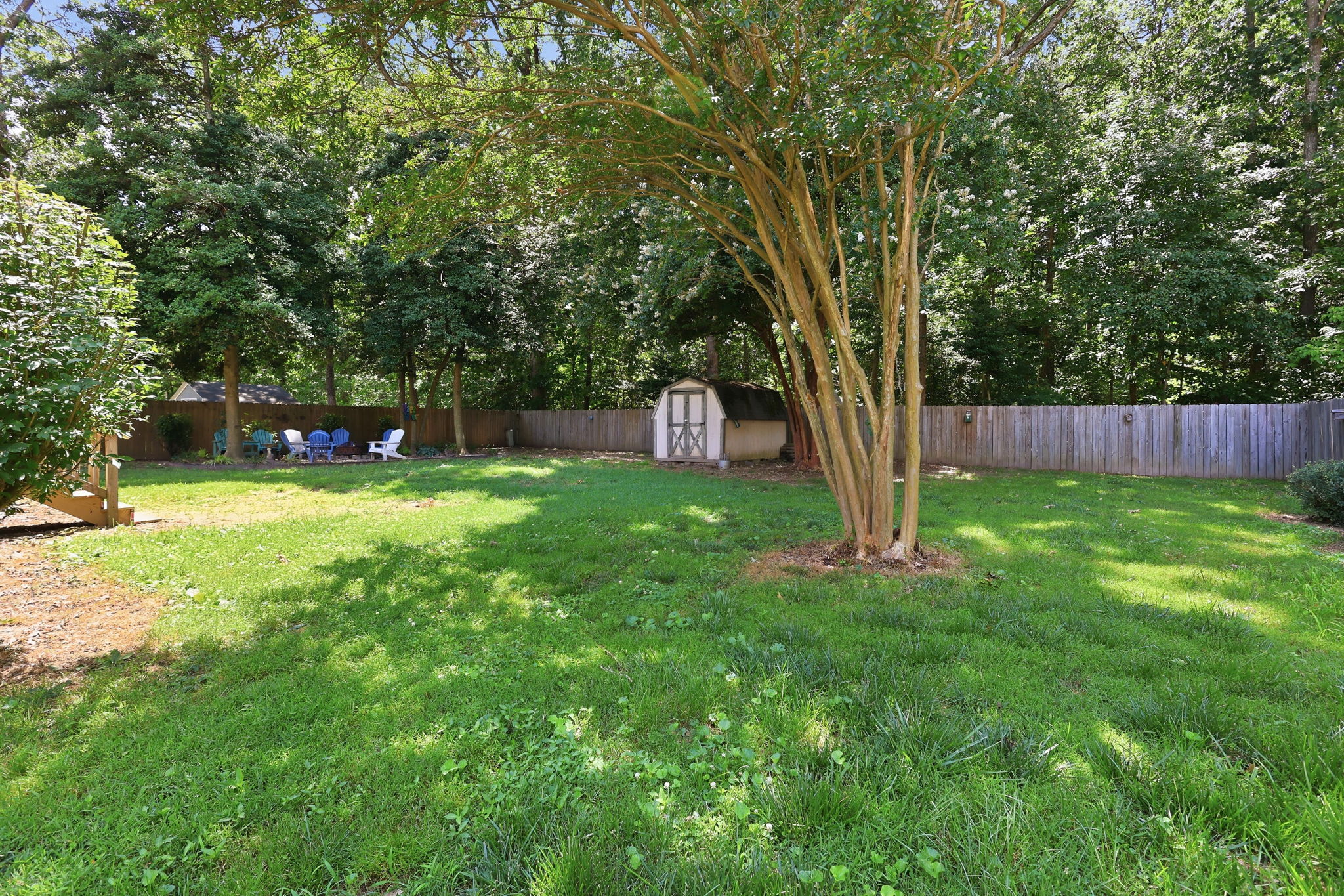 Fully fenced back yard that backs to trees
