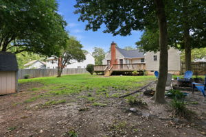 Large, flat, and open back yard, beautifully shaded and space to entertain