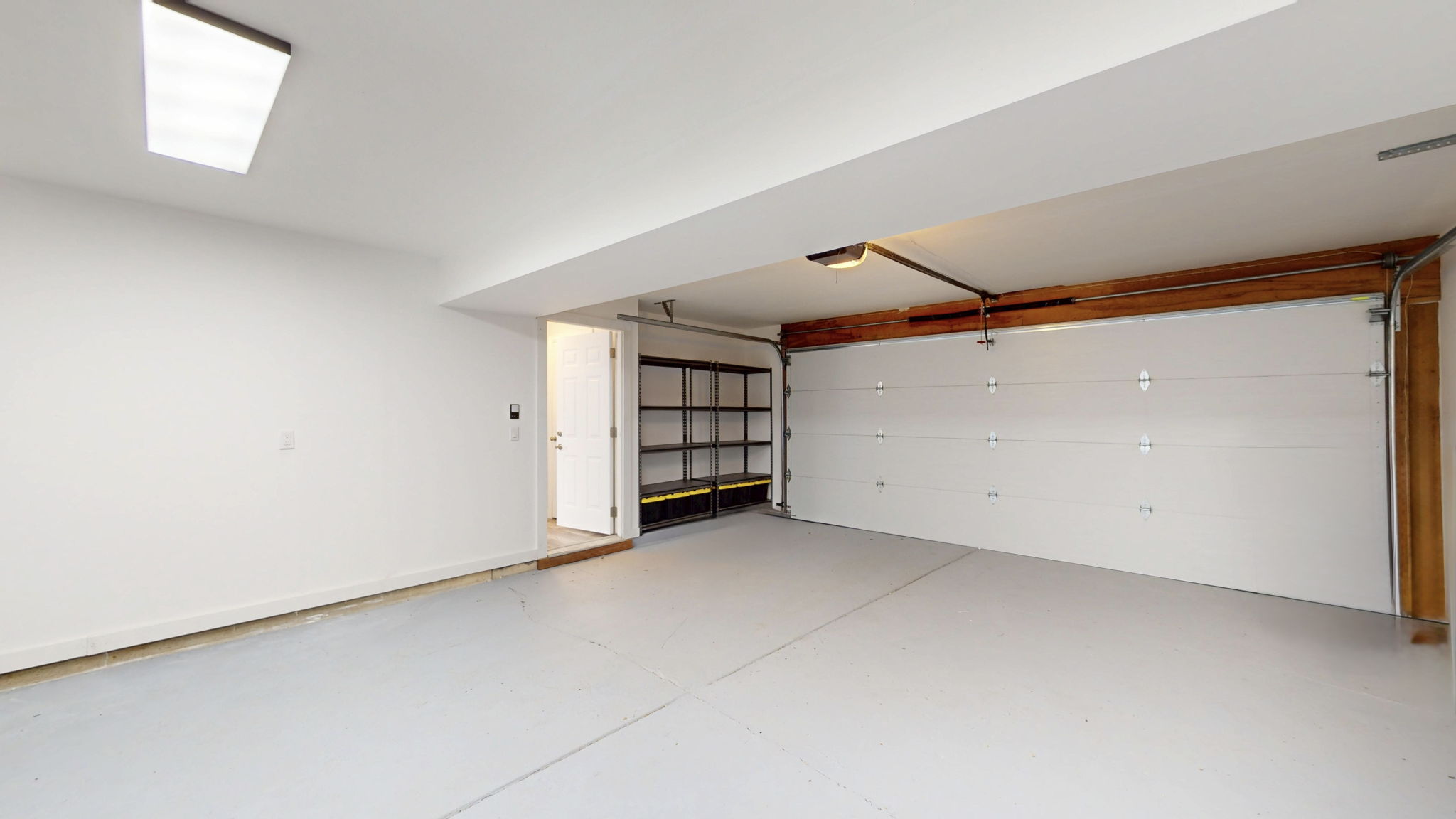 Newly finished garage with new garage door