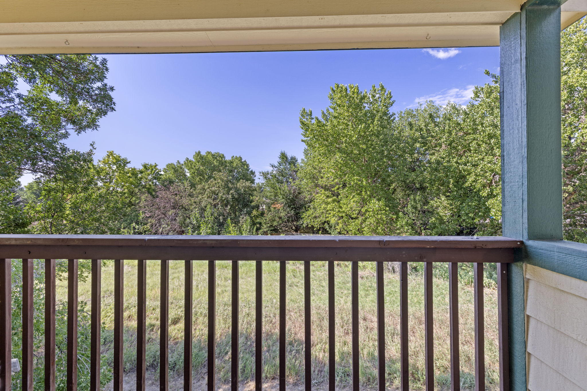 Relax on The Balcony That Backs Up to a Lush Greenbelt