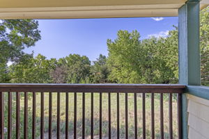Relax on The Balcony That Backs Up to a Lush Greenbelt