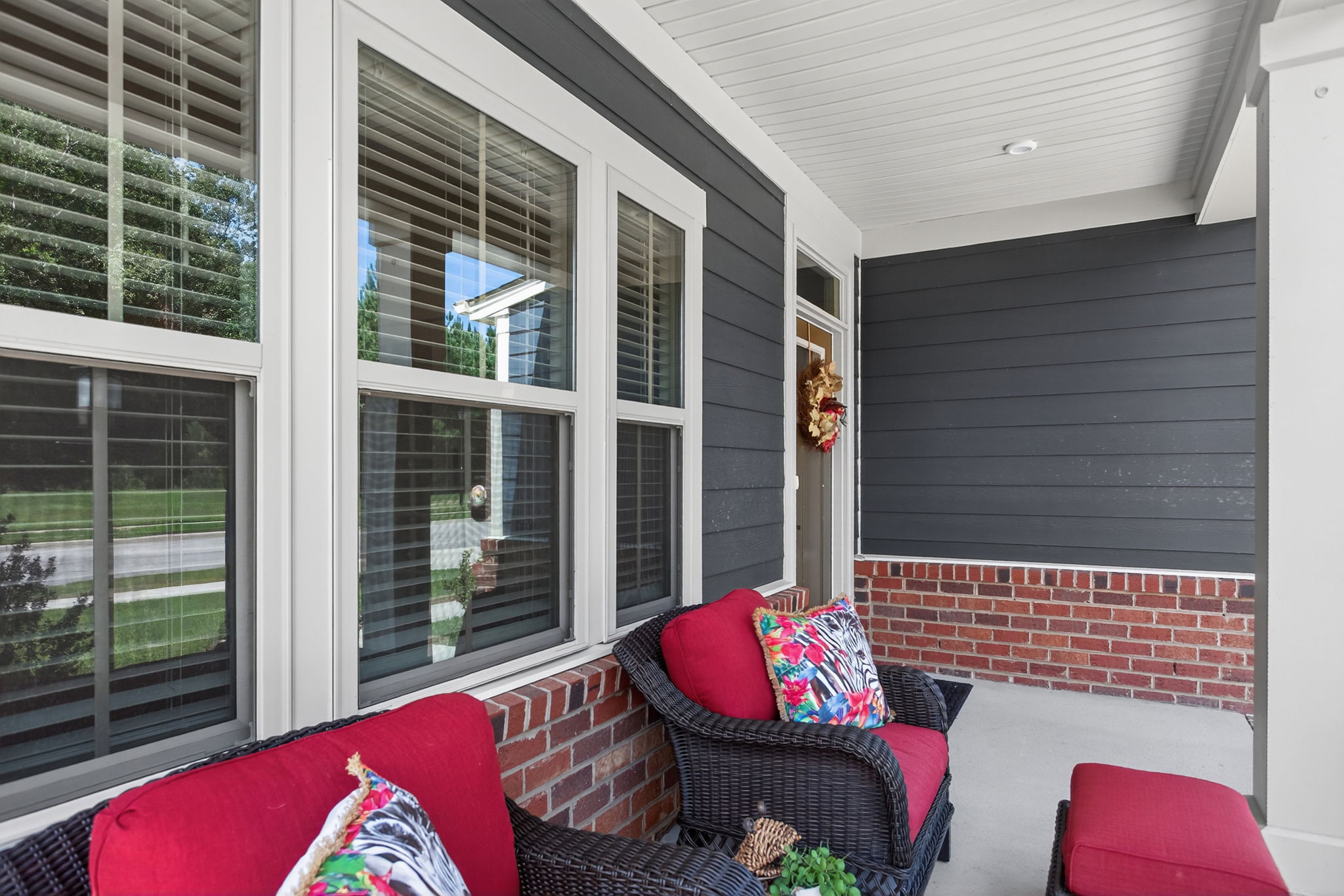 Comfortable porch with a partially wooded view