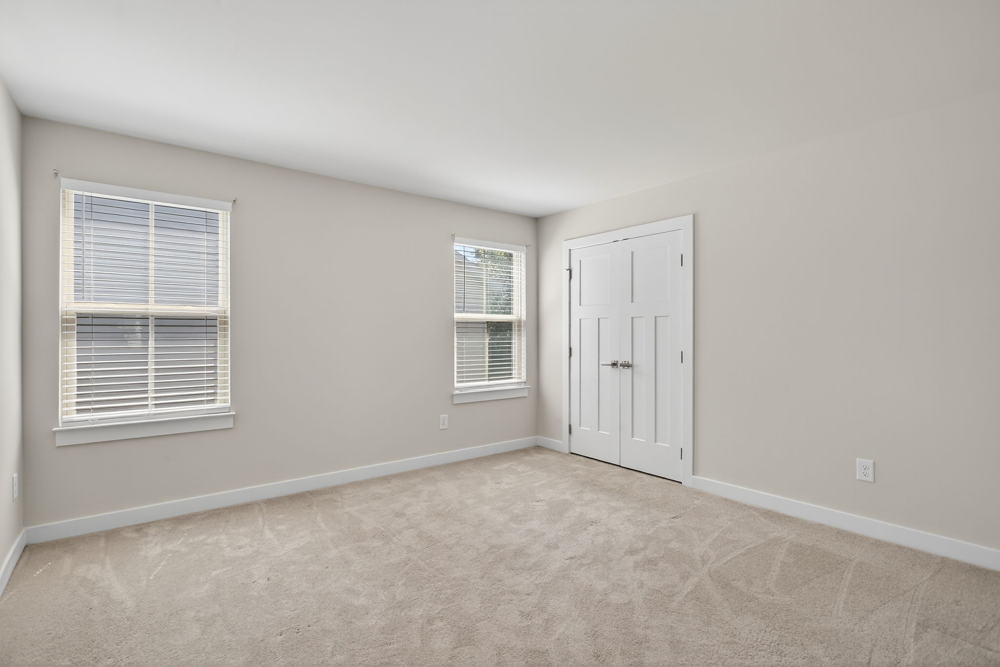 Bedroom with double closet doors