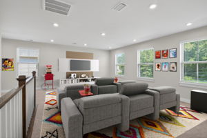 Virtually staged loft, perfect for a media room!