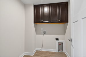 2nd floor laundry, cabinets, and floor space for baskets