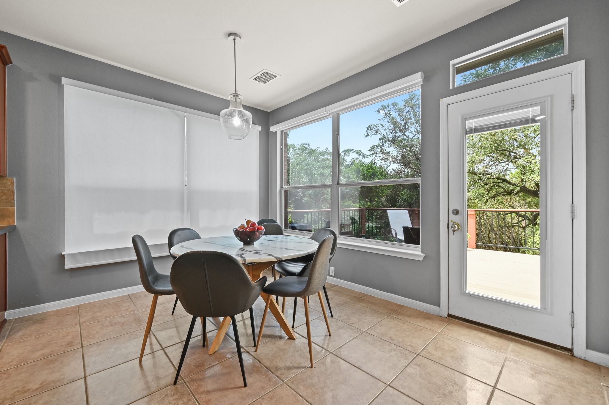 Kitchen Eating Area. Large Space. The door opens up to the back deck, yard, & trails.