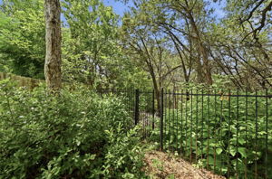 The back leads directly to the trails on Slaughter Creek which also connects to Mary Moore Searight Park -- Over 300 acres of land with facilities for outdoor adventures.