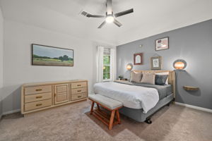 3rd Bedroom Upstairs. New Ceiling Fan. There is a TV on the wall opposite from the bed and it conveys.