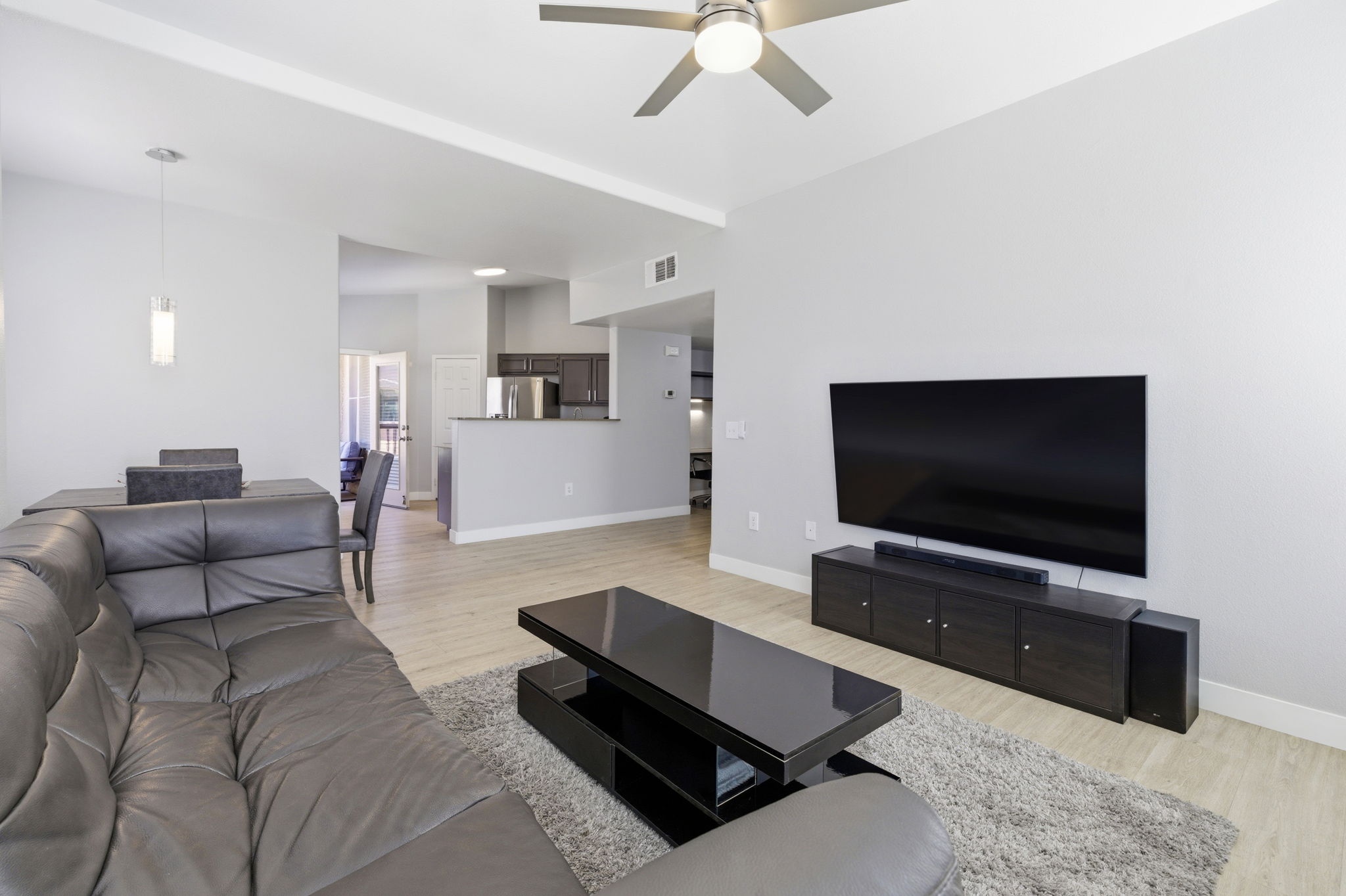 Flow from living to kitchen to balcony.