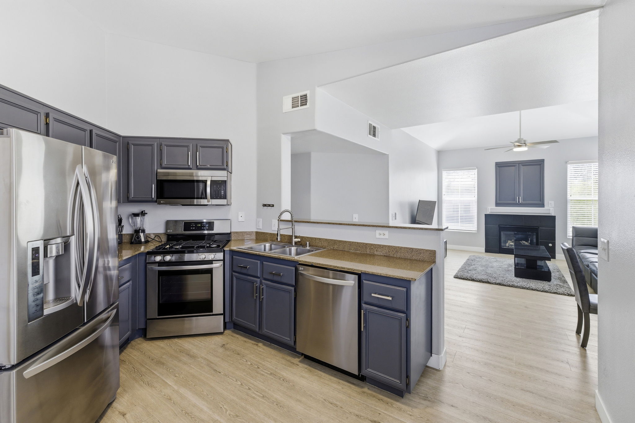 See through kitchen to living with natural light all around.